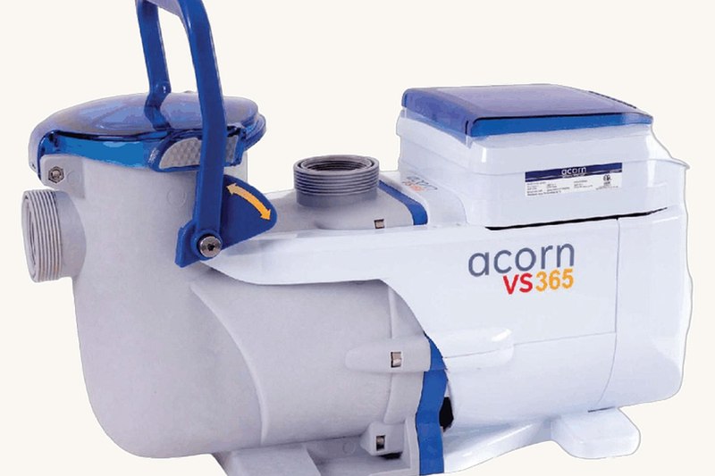 The redesigned variable-speed pool pump — white body, blue quick-cam lid, integrated handle and shroud